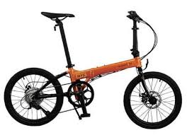 A dahon folding bike 16″ reduces to the size of a shopping bag and fits under a bus seat or in an airline luggage bin; 20 The Accidental Randonneur