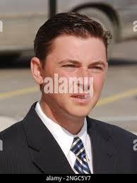 William Paulson, a fan involved in the brawl at The Palace of Auburn Hills,  waits with his attorney outside 52nd District Court in Rochester Hills,  Mich., April 22, 2005. Nine defendants charged in the November brawl at the  Pistons-Pacers game, including five ...