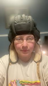 Mom my hat has a funny symbol, he calls out as I put his hats