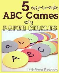 A fun activity for kids to learn the alphabet. Little Family Fun 5 Abc Games Using Paper Circles Alphabet Games Preschool Preschool Learning Preschool Games
