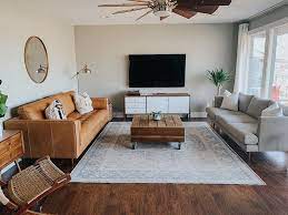 Update your living room furniture with a new living room set. Our Living Room Is Finally Coming Together Living Room Decor Lights Tan Living Room Living Room Without Tv