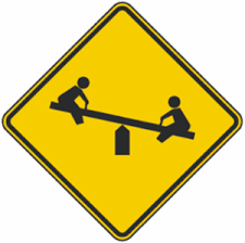 The purpose of the playground ahead sign is to provide advance warning of a locally designated playground that is located adjacent to a downstream section of road. Playground Ahead Traffic Warning Signs