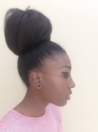 An Easy To Style Natural Hair Bun Using Braiding Hair For Black Women.