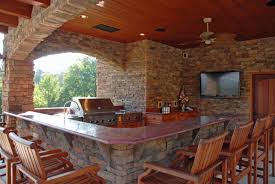 A brick courtyard patio ties together the different components of this outdoor space: Stone Work Bryant Lawn And Sprinkler Fort Worth