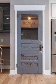 Wood is the most popular type of material used in pantry doors. Why A Cool Pantry Door Is The Secret Ingredient To A Cool Kitchen Design Designed Home Remodeling Rustic House Home Decor
