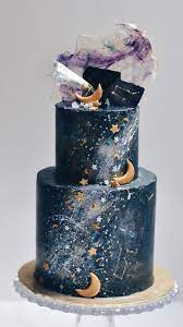 Celestial Wedding Cake Moon Stars On Two Tier Dark Blue Wedding Cake Galaxy Cake Wedding Cake Recipe Beautiful Wedding Cakes
