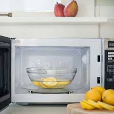 Steam Clean Your Microwave By Putting Two Halves Of Lemons In 1 2 Cup Of Water Cook For A Few Minutes Then Ea Clean Microwave Cleaning Hacks Cleaning Recipes