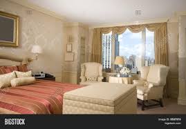 A sitting area is nestled into a charming bay. Master Bedroom Sitting Image Photo Free Trial Bigstock