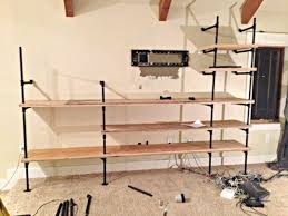 These shelves are petty heavy so you will want to make sure they are properly secured to the wall. Diy Industrial Pipe Shelves Twelve On Main