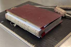 Participants will deconstruct the book by detaching the covers and spine; Book And Bible Restoration And Repair York Bookbinding