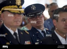 Col. Raymond Figueroa attends a ceremony at the Puerto Rico Capitol to  dedicate a monument for nine Airmen assigned to the 156th Airlift Wing in  San Juan May 27, 2018. The nine