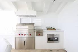 Maybe you would like to learn more about one of these? Outdoor Covered Patio Kitchen Features A Plank Ceiling Over White Shiplap Clad Walls Lined With A Wolf Bbq Patio Kitchen Outdoor Kitchen Design Outdoor Kitchen
