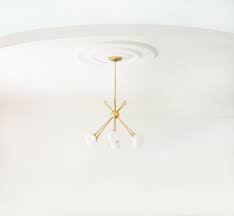 My aesthetic needs are not met when i see that fixture hang at the feet of the bed. Roundup Ceiling Medallions Room For Tuesday Blog