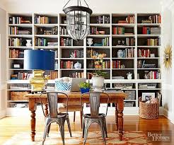 Wall To Wall Bookshelves And A Sturdy Farmhouse Table Help This Versatile Room Pull Double Duty As Both A Home Office Dining Room Office Dining Room Small Home