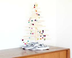 Use as decorative tree garland, lay it on a surface around larger items, hang on a wall, display on a fireplace mantel or in front of a window. How To Make A Colorful Felt Ball Garland In 15 Minutes Diy Video