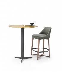 Fly is a family of dining tables, end tables and cabinets. Fly Tables