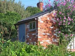 The shed can give you amazing ideas for potting. 3 Shed 1 Brick Shed Shed Landscaping Shed Design