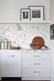 Trend Time Slab Backsplash And Why You Need This Studio 52 Interiors Traditional Kitchen Design White Modern Kitchen Modern White Kitchen Cabinets