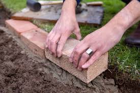 How to lay garden edging blocks. How To Edge A Lawn With Bricks Bbc Gardeners World Magazine