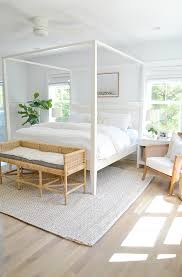 Light And Airy Master Bedroom Bright Home Light Wood Floors Ratan Bench White Bedroo Coastal Bedroom Decorating White Master Bedroom White Wall Bedroom