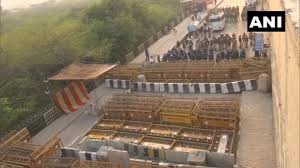 Iron nails, rods, barbed wire, rocks, and makeshift walls are used to barricade the delhi border against thousands of protesting farmers. Farmers Protest Delhi Police Cements Nails Barricades At Ghazipur Tikri Borders Ani Bw Businessworld
