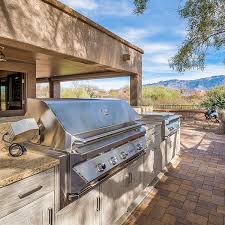 Hard afternoon light heated her small table. Outdoor Cabinets Affordable Outdoor Kitchens