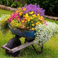 13 Creative Designs For Easy Diy Planters Garden Containers Garden Projects Wheelbarrow Planter