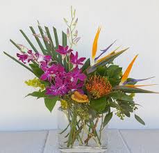 In lieu of sending flowers, planting a tree is a wonderful way to memorialize any lost loved one. Send Tropical Bliss In Scottsdale From Paradise Valley Florist Beautiful Tropical Bliss By Tropical Flower Arrangements Flower Delivery Tropical Centerpieces