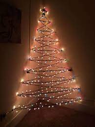 39 Diy Wall Christmas Tree To Save Your Space Godiygo Com Creative Christmas Trees Christmas Decorations Apartment Wall Christmas Tree