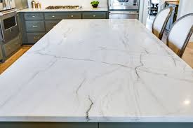 Black And White Quartzite Aria Quartzite Has A Creamy White Background That Features Deep Black And Grey Veining T Quartzite Countertops White Quartzite Countertops Kitchen Countertops