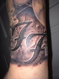 Let's celebrate the greatest rock band in the world with these cool foo fighters tattoos. Foo Fighters Tattoo By Allan Lowther At Northside Tattooz Foo Fighters Tattoo Tattoos Band Tattoo