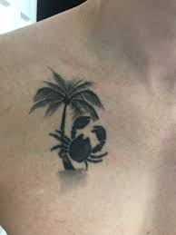 A combination of dots, stars, and hearts make up this tattoo, and it features the small, minimalist symbol that represents the sign to tie the constellation back to. Cancer Zodiac Sign With Palm Tree Inkstained Ca By Flacco Tattoos