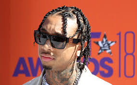 The undercut, curly short hair on top, and long braid all contrast quite starkly with one another. Best Hip Hop Hairstyles For Men Celebmix