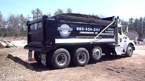 Dump trucks can usually carry about 10 to 14 cubic yards of dirt. Kenworth T300 Dumping 20yds Of Bark Mulch Youtube