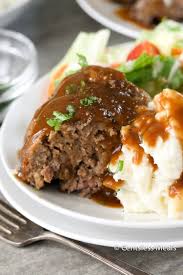A Serving Of Stove Top Meatloaf On A White Plate Served With Mashed Potatoes And A Side Salad Stove Top Meatloaf Stove Top Recipes Stove Top Stuffing Meatloaf