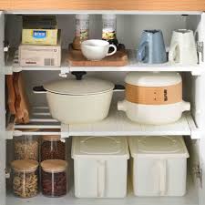 The main shelf is a metal grid supported by four small struts. Extendable Wardrobe Cabinet Shelf Divider Style Degree Singapore