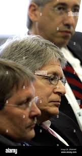 Durham County District Attorney Mike Nifong, center, listens with his  attorneys David Freedman, top, and Dudley Witt during a North Carolina  State Bar hearing in Raleigh, N.C., Friday, April 13, 2007.A disciplinary