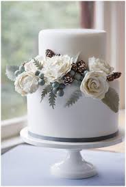 Two tier wedding cake petal raffles and beading. Our Favorite Winter Wedding Cakes Wedding Inspiration