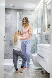 I love the look of stacked white towels in a bathroom and i didn't want all of them hidden in the linen closet. Mother And Daughter Having Fun In The Bathroom Awf00079 Inner Vision Pro Westend61