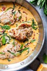 The sauce is made in the same skillet from the pan drippings along with a few other ingredients. Creamy Basil Skillet Pork Chops