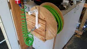Air Hose Reel I Made From A Cable Spool 1 Pvc And Scrap Plywood Air Hose Reel Homemade Tools Hose Reel