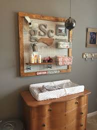 My Sons Nursery We Made A Peg Board Changing Station Ordered Standard Peg Board Baskets For Baby Boy Room Decor Rustic Baby Nurseries Rustic Baby Boy Nursery