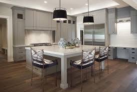 Expansive Gray Kitchen Showcases A Stunning Large Square Center Island Fitted With Legs And A Square Kitchen Kitchen Island Quartz Top White Quartz Countertop