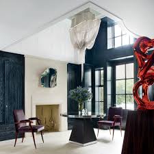 In the entry hall of a london home designed by rafael de cárdenas, a cascading light. Ideas For Decorating With Sculptures Architectural Digest