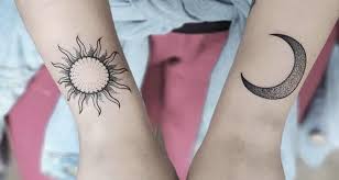 The moon and sun are depicted in tribal styles in this black wrist tattoo set. Top 50 Outstanding Sun And Moon Tattoo Designs 2021