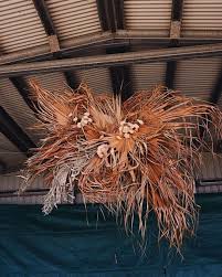 The major exotics are palm spear, lotus pods, bell cup, mehogany pods, cattails, canella berries, pine cones, buddha nut, luffa, strobus, cedar rose, badam, babla, mintolla ball, lily etc. In The Clouds With Dried Flower Installations Thursd