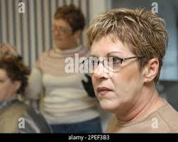 **ADVANCE FOR WEEKEND EDITIONS OF JAN. 22 AND 23** Kathy Mitchell, owner of  360 Degree Salon in Plainfield Conn. talks about serial killer Michael  Ross, Thursday, Jan. 20, 2005. Mitchell and her twin sister Debra Smith, in  background, were ...