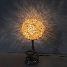 A common form of the lampshade on a floor lamp, for example, uses cloth or paper with a loose weave to block significant amounts of light in a horizontal direction. Asia Creative Spiral Hemp Rope Night Lamp Single Bulb Table Light With Ball Rattan Woven Shade In Light Yellow Beautifulhalo Com