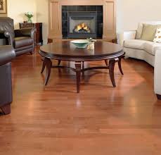 Living Room Idea With Hardwood Floor Vs Laminate And Round Coffee Table Plus Fireplace Waterproof Laminate Flooring Wood Floor Inspiration Solid Wood Flooring