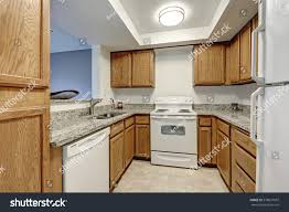 small u shaped kitchen filled wood
